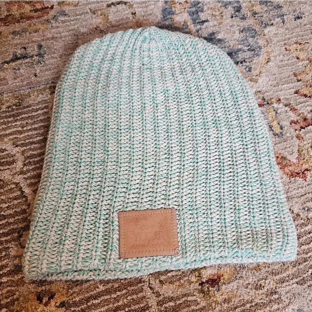 Love your melon teal and white beanie with leather patch